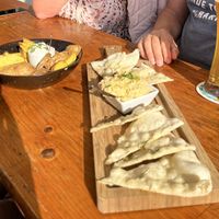 Tapas: potato wedges and focaccia w hummus  at Alecrim in Carrapateira
