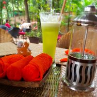 Green goddess juice and peppermint scented towel at Peace Cafe in Siem Reap