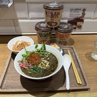 The black sesame ramen set and 3 cup noodles they sell at the restaurant  at T's Tantan - JR Ikebukuro in Tokyo