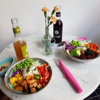 Tofu Terijaky Bowl(vegan, left) and Salmon Poké Bowl(with fish, right) at Holy Nosh Deli in Kassel