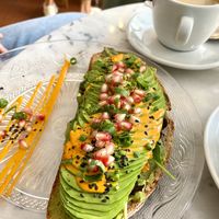 vegan avocado bread w/ pomegranat seeds, siracha mayo & spring onions 🥑 at Holy Nosh Deli in Kassel