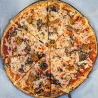 red sauce, vegan cheese, crimini mushrooms, and vegan sausage at The Pizza Press in Pearl City