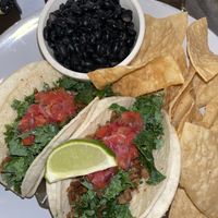 Seitan tacos with black beans and chips  at Kale My Name in Chicago