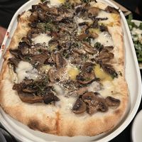 MAGIC MUSHROOM $27.00
Mozzarella, Seasonal mix roasted mushrooms, trutte cream & lemon thyme (our other pizza option choice from the banquet menu) 
  at Nonna's Nightmare in West End