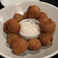 CRUMBED STUFFED OLIVES $14.00
Crumbed fried olives stuffed with seasonal veggies and truffle mayo (CF, 0) Delicious morsels on the banquet menu!   at Nonna's Nightmare in West End