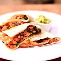 Quesadilla with sweat potatoes, beans and plant based cheddar served with guacamole. One of vegan offers from weekly changing lunch menu.  at The Street  in Prague