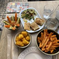 Hummus, mushrooms empanada, sweet potatoes fries, deep fried polenta  at Tavila Cafe in Tavira