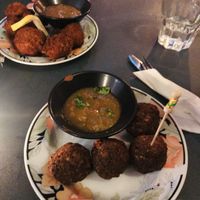 Top Kentucky’s fried cauliflower and bottom fried attieke balls at L'Embuscade in Paris