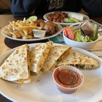Chicken Quesadilla with a side salad, Fish and Chips  at Queens Coach in Niagara Falls