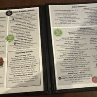 When you open the menu, the first pages are Vegan Menu! Way to go ❤️  at Queens Coach in Niagara Falls