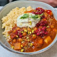 The dish "marokanen", vegetables & pomegranate served with cous cous, pistachios and yoghurt. at Skrymslet Under Trappan in Norrkoping