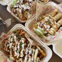 Loaded chili cheese fries, nachos, and rolled potato taco special  at Chicana Vegana in Fullerton