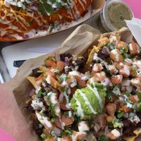 Burrito Mojado y Loaded Nachos con Salsa Verde  at Chicana Vegana in Fullerton