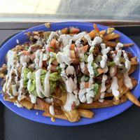 Signature fries with al pastor + carnitas  at Chicana Vegana in Fullerton