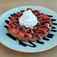 Chocolate sauce, maple syrup, strawberries, and vegan cream at Heart-Garden Waffles & Coffee in Amsterdam