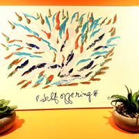 Beautiful and colorful Artwork from the owners spiritual inspiration source Sri Chinmoy all around the cafe.  at Heart-Garden Waffles & Coffee in Amsterdam