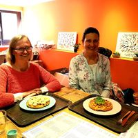 Visiting with a dear friend, nice waffles and great atmosphere. This is the downstairs seating area. Upstairs is the blue seating area. They also have  a terrace. at Heart-Garden Waffles & Coffee in Amsterdam