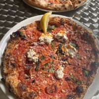 pizza puglia in the front and dr drooly in the back  at Dr Drooly in Munich