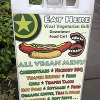 Sign in front of parking lot  at Viva! Vegetarian Grill - Food Cart in Eugene