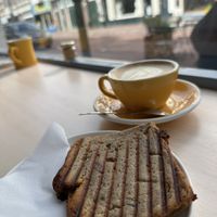 Flat white (oat milk) and banana breadd  at Tigershark Coffee in The Hague