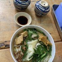 Dumpling noodle soup, comes with some condiments: sauce, spicy flakes and limes  at Nuoc Leo Chay in Ho Chi Minh City