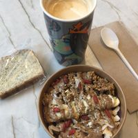 Almond Famous acai bowl, oat milk latte, and a lemon poppyseed pastry! at Kokomo in North Vancouver