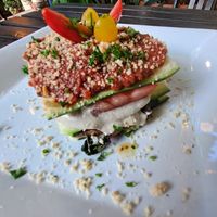 Loving Lasagna: zucchini noodles, hemp seed pesto, cashew alfredo, and Marinated veggies. Topped with marinara and cashew parm at Peace Pies in San Diego