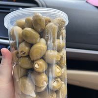 Be sure to try some garlic olives from Mr. and Mrs. Pickle. Phenomenal !  at Winter Garden Farmers Market in Winter Garden