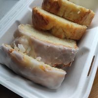 takeaway box of vegan lemon drizzle and lemon and orange cakes at Freedom Caffe in Sutton