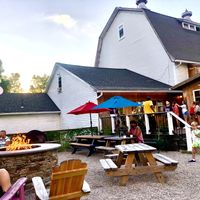 Outdoor seating and big barn. Rustic!  at Rice Fruit Farm in Wilbraham