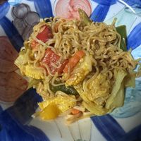 Some of their dinner which they shared in trade to HappyCow stickers   at Kaek Kao Kua in Bangkok