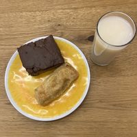 A pastry “sin carne”,a cake with a bocadillo centre topped with chocolate and a rice based drink   at The Vegan Bakery (formerly Panadería Rocks) in Bogota