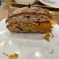 Half of the quinoa tofu pumpkin burger with walnut nap bread at Cedele - Novena Square in Central Singapore