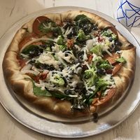 Vegan cheese & pepperoni with spinach, sundried tomatoes, onions, broccoli, basill  at Pretzel & Pizza Creations in Frederick