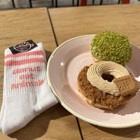Lotus donut, pistachio donut and Brammibal's merch socks!   at Brammibal's Donuts - Friedrichshain in Berlin