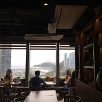 View of Aberdeen Harbour, Jumbo and boats. African patterned cushions and decor at Africa Coffee & Tea in Hong Kong Island
