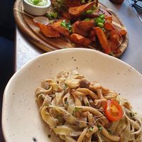 Jackfruit burger and mushroom sauce pasta at Kozy Eats  in Riga