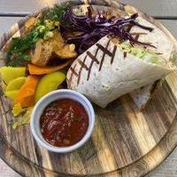 Burrito with pb mince, wedges, salad, pickles at Kozy Eats  in Riga