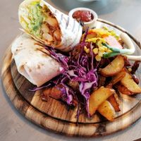 Burrito with potato wedges at Kozy Eats  in Riga
