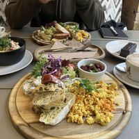 Kozy breakfast with Tofu scramble, salad, cottage cheese, bread and beans. Rasols salad to the left, snickers cake to the right.  at Kozy Eats  in Riga