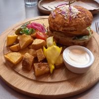 Cesar burger with vegan Parmigiano. Tasty AF! at Kozy Eats  in Riga