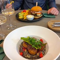 Creamy lentils with asparagus (at the front) and mushroom burger (at the back) at Kozy Eats  in Riga