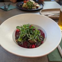 Creamy black lentils with aspargus at Kozy Eats  in Riga
