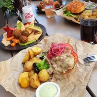 Topless burger & Hummus bowl at Kozy Eats  in Riga