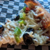 Vegan cheese, black olives, and green peppers. at Walking Man Brewing in Stevenson