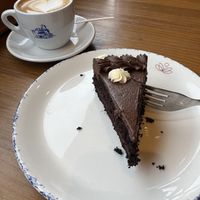 trible choclate cake, coffee with oat milk  at Celicioso Callao in Madrid