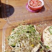 Hummus toast. I ordered it with spinach, I got tomato and onion instead! at Bean Rush Cafe in Annapolis