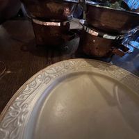 The food is served on top of a hot flame/candle   at Mantra in Oslo