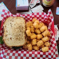 Chicken Salad Sandwich with a side of Tots at Tree Hugger Plant-Based Kitchen in Kansas City