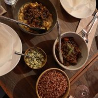 Cashew curry, eggplant curry, plain hopper, green pol sambol and red rice   at Lankan Filling Station in Sydney